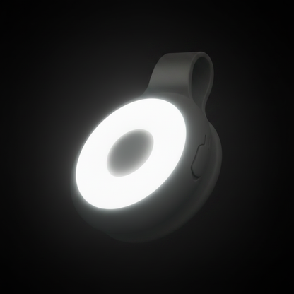 KlipIt grey magnetic clip-on ring light glowing in dark studio