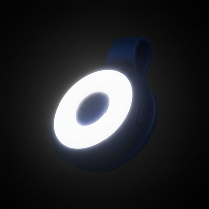 KlipIt blue magnetic clip-on ring light glowing in dark studio